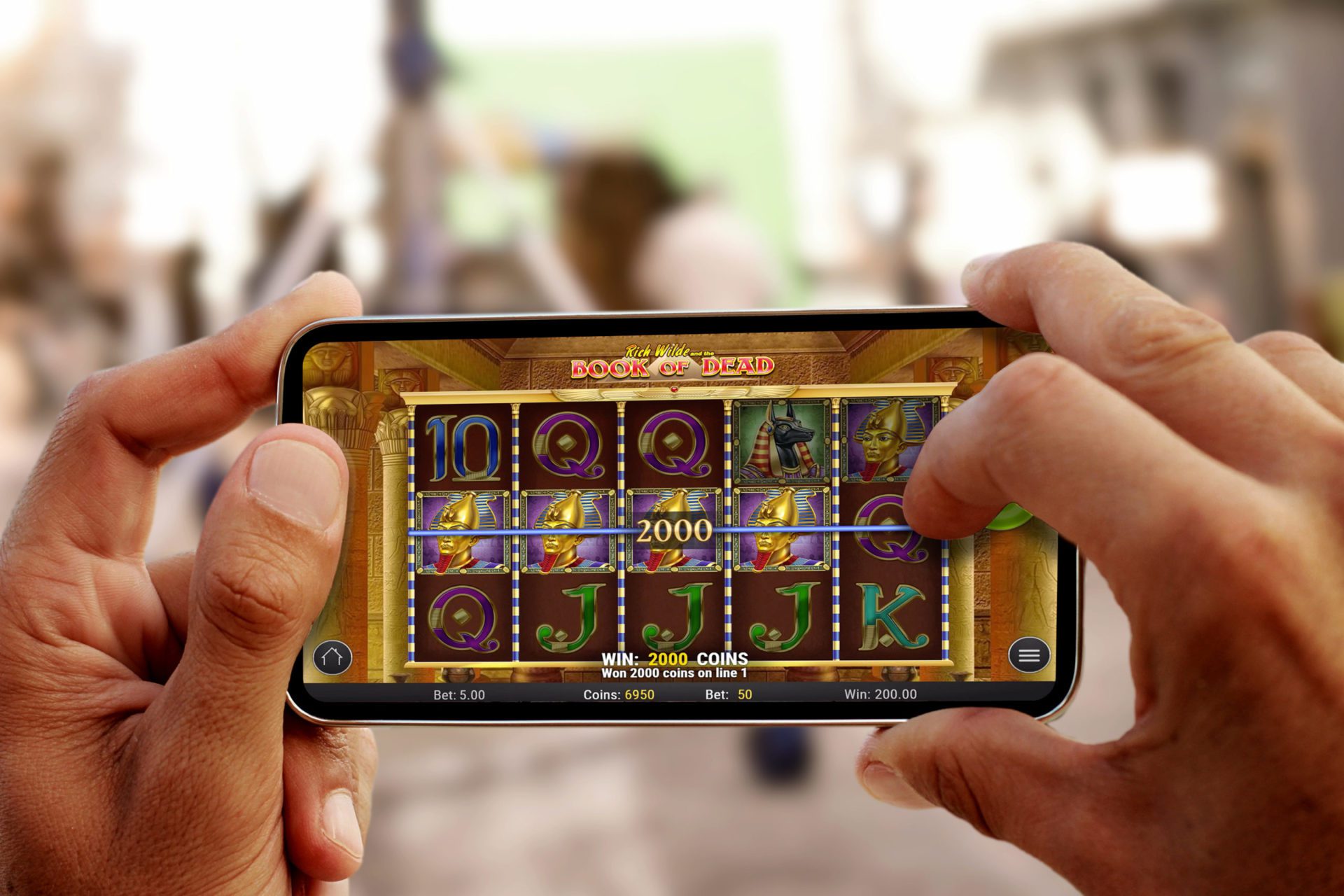 Close up on male hands taking photo of sea coast with mobile cell phone. Summer beach holiday vacation concept