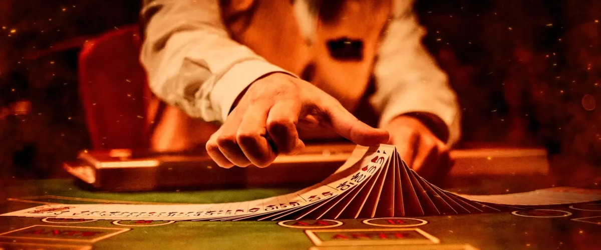 Blackjack dealer shuffling cards.
