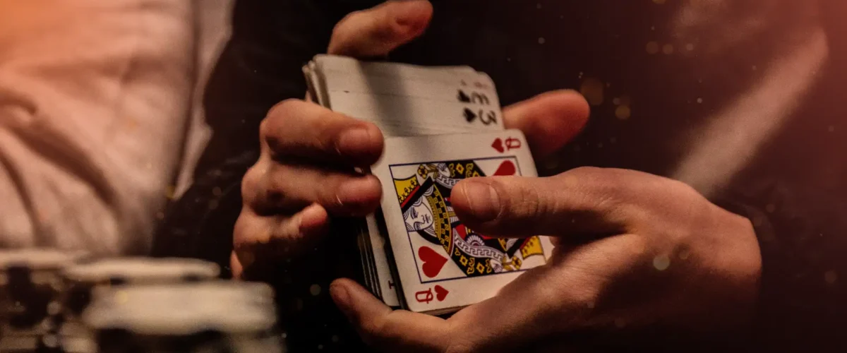 blackjack session strategy: a dealer shuffling cards