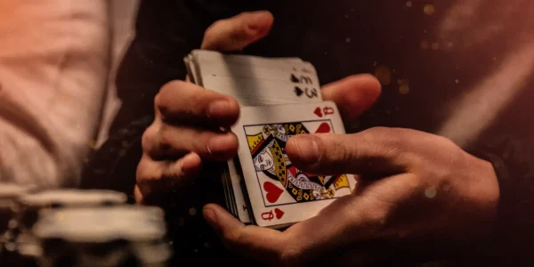 blackjack session strategy: a dealer shuffling cards